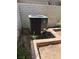 A home's air conditioning unit is situated outside in a yard area surrounded by brick at 2100 Plaza Del Padre, Las Vegas, NV 89102