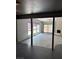Spacious living room with a stone fireplace, large windows, and sliding door access at 2100 Plaza Del Padre, Las Vegas, NV 89102