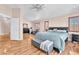Spacious bedroom with hardwood floors, ample natural light, and sitting area at 2104 Spanish Town Ave, North Las Vegas, NV 89031