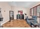 Bedroom featuring wood floors, a relaxing chair, and natural lighting at 2104 Spanish Town Ave, North Las Vegas, NV 89031