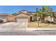 Charming two-story home with a well-manicured lawn and a spacious two-car garage at 2104 Spanish Town Ave, North Las Vegas, NV 89031