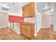 Upstairs hallway featuring wood floors and built-in storage cabinets at 2104 Spanish Town Ave, North Las Vegas, NV 89031