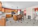 The spacious kitchen has an island and a view into the dining room and the home's entrance at 2104 Spanish Town Ave, North Las Vegas, NV 89031