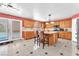 Open kitchen has lots of cabinet space with an island and direct views to the pool outside at 2104 Spanish Town Ave, North Las Vegas, NV 89031