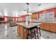 The spacious kitchen has an island and views into the living room and backyard at 2104 Spanish Town Ave, North Las Vegas, NV 89031