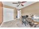 Home office with ample storage and large workspace with natural lighting at 2104 Spanish Town Ave, North Las Vegas, NV 89031