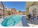 Stunning backyard with a private pool, mature landscaping, and a cozy seating area at 2104 Spanish Town Ave, North Las Vegas, NV 89031