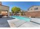 Beautiful backyard features a private pool, patio area, and lush greenery at 2104 Spanish Town Ave, North Las Vegas, NV 89031