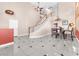 Open-concept entryway featuring staircase to the second level with dining room and chandelier at 2104 Spanish Town Ave, North Las Vegas, NV 89031