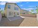 Well-maintained backyard with patio and desert landscaping, perfect for relaxation and outdoor enjoyment at 2228 Sky Island Dr, Henderson, NV 89002