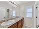 Bright bathroom featuring double sinks, granite countertops, and lots of light at 2228 Sky Island Dr, Henderson, NV 89002