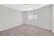 This is a small bedroom with carpet floors and a window at 2228 Sky Island Dr, Henderson, NV 89002