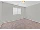 This is a small bedroom with carpet floors and a window at 2228 Sky Island Dr, Henderson, NV 89002