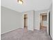 Neutral bedroom with carpet, walk-in closet, and an open door to additional rooms at 2228 Sky Island Dr, Henderson, NV 89002