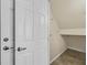 Hallway with doors leading to storage and other rooms at 2228 Sky Island Dr, Henderson, NV 89002
