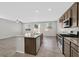 Bright, modern kitchen featuring a center island, stainless steel appliances, and an open floor plan at 2228 Sky Island Dr, Henderson, NV 89002