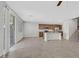 Bright kitchen and living space boasts a large island, stainless steel appliances, and tile flooring throughout at 2228 Sky Island Dr, Henderson, NV 89002