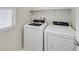 Efficient laundry room featuring a modern washing machine and dryer set with natural light at 2228 Sky Island Dr, Henderson, NV 89002