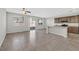 Bright living space boasting tile floors, natural light, and an open-concept layout connecting to the kitchen at 2228 Sky Island Dr, Henderson, NV 89002