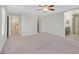 Spacious main bedroom with ceiling fan and ensuite bathroom and walk-in closet at 2228 Sky Island Dr, Henderson, NV 89002