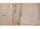 Bright bathroom featuring glass-enclosed shower and separate tub at 2325 Windmill Pkwy # 312, Henderson, NV 89074