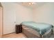 Cozy bedroom with light wood floors and ceiling fan at 2325 Windmill Pkwy # 312, Henderson, NV 89074