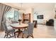 Inviting dining area featuring a stylish chandelier, hardwood floors, and an open floorplan concept at 2325 Windmill Pkwy # 312, Henderson, NV 89074