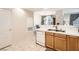 Bright kitchen featuring wooden cabinets, and stainless steel appliances at 2325 Windmill Pkwy # 312, Henderson, NV 89074