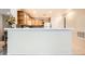 Bright kitchen featuring wooden cabinets, white countertops, and backsplash at 2325 Windmill Pkwy # 312, Henderson, NV 89074