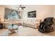 Bright living room featuring contemporary decor, recessed lighting, neutral paint and elegant window treatments at 2325 Windmill Pkwy # 312, Henderson, NV 89074