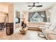 Inviting living area with a sectional sofa, recessed lights, and hardwood floors for a welcoming ambiance at 2325 Windmill Pkwy # 312, Henderson, NV 89074