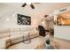 Cozy living room featuring a sectional couch, contemporary decor, and hardwood floors for a luxurious living experience at 2325 Windmill Pkwy # 312, Henderson, NV 89074
