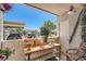 Cozy patio with table and chairs, plants, and a view of the neighborhood at 2325 Windmill Pkwy # 312, Henderson, NV 89074