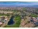 Aerial view showcasing a golf course winding through a beautiful, Primary-planned community at 248 Windmill Croft Dr, Las Vegas, NV 89148