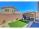 Private backyard featuring an outdoor seating area under a gazebo and artificial turf at 248 Windmill Croft Dr, Las Vegas, NV 89148