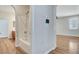 Well-lit bathroom featuring a tub with shower and wood-look floors at 248 Windmill Croft Dr, Las Vegas, NV 89148