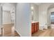 Hallway view into bathroom, showing vanity and toilet at 248 Windmill Croft Dr, Las Vegas, NV 89148