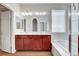 Bathroom with double vanity, a large mirror, a tub and a walk-in shower at 248 Windmill Croft Dr, Las Vegas, NV 89148