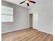 Bedroom with closet, window, and wood-look flooring at 248 Windmill Croft Dr, Las Vegas, NV 89148