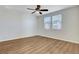 Bright bedroom with a ceiling fan and two windows offering natural light at 248 Windmill Croft Dr, Las Vegas, NV 89148