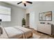 Cozy bedroom with neutral decor, a ceiling fan, and natural light at 248 Windmill Croft Dr, Las Vegas, NV 89148