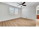 Bright bedroom with wood-look floors, neutral walls and ceiling fan at 248 Windmill Croft Dr, Las Vegas, NV 89148