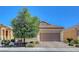 Charming home with a well-maintained yard, inviting curb appeal, and a two-car garage at 248 Windmill Croft Dr, Las Vegas, NV 89148