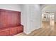 Hallway featuring a built-in bench and coat rack with access to the kitchen at 248 Windmill Croft Dr, Las Vegas, NV 89148