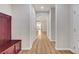 Long hallway with entry area, archways, and consistent wood-look flooring at 248 Windmill Croft Dr, Las Vegas, NV 89148
