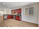 The kitchen has stainless steel appliances, wooden cabinets, and an open layout at 248 Windmill Croft Dr, Las Vegas, NV 89148