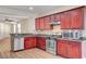 Well-lit kitchen features stainless steel appliances and warm wood cabinets at 248 Windmill Croft Dr, Las Vegas, NV 89148