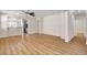 Spacious open concept living room with wood-look flooring and neutral paint at 248 Windmill Croft Dr, Las Vegas, NV 89148