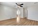 Open living room showcasing wood-look floors and an arched doorway at 248 Windmill Croft Dr, Las Vegas, NV 89148