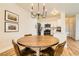 Well-lit dining area with a round table and easy access to a modern kitchen at 251 S Green Valley Pkwy # 1311, Henderson, NV 89012